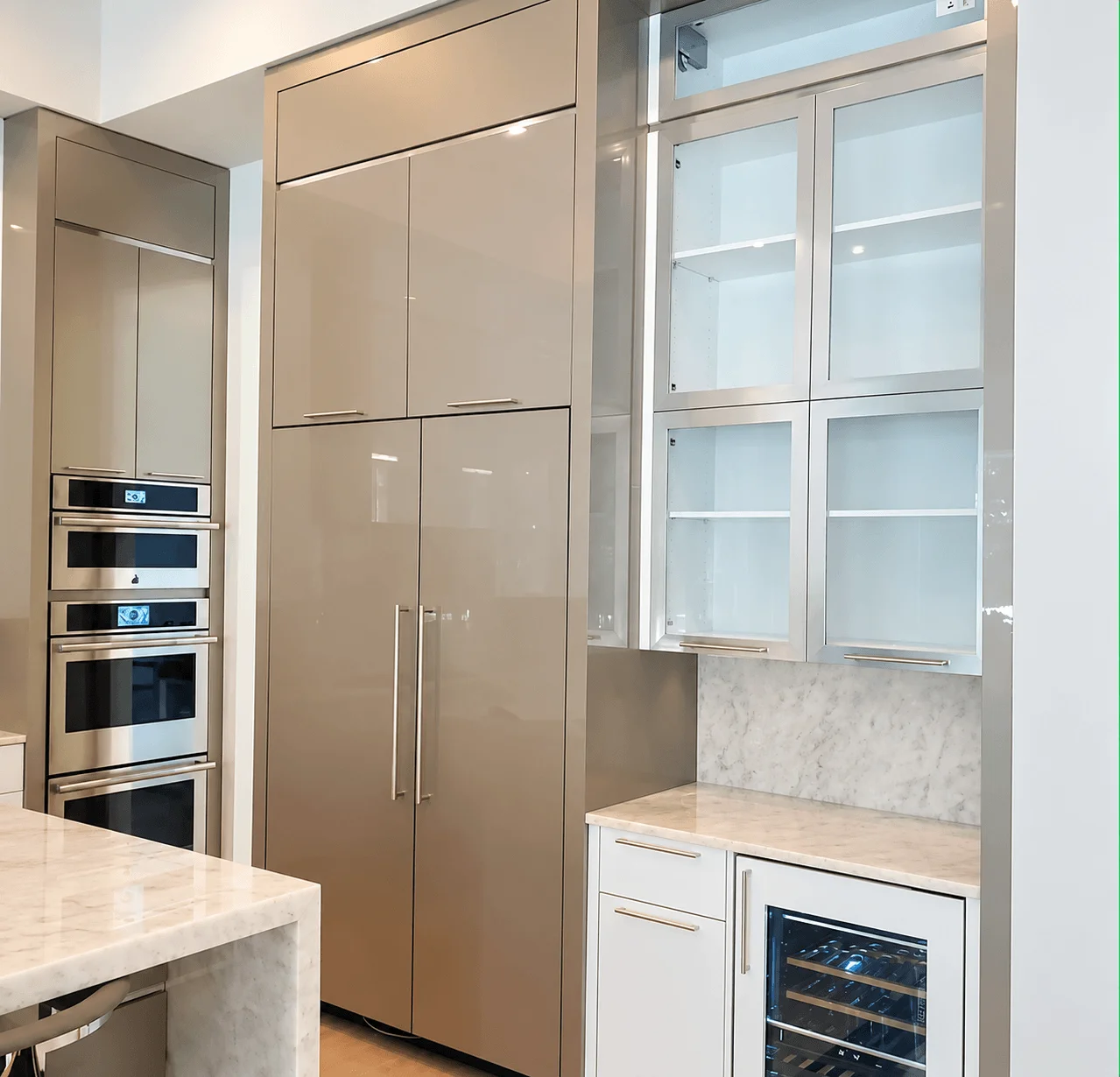 High-end kitchen with flat-panel cabinetry and glass display cabinets