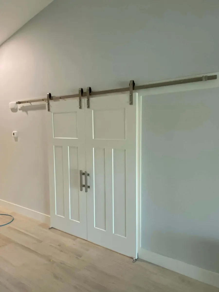 White double barn doors on a sliding rail