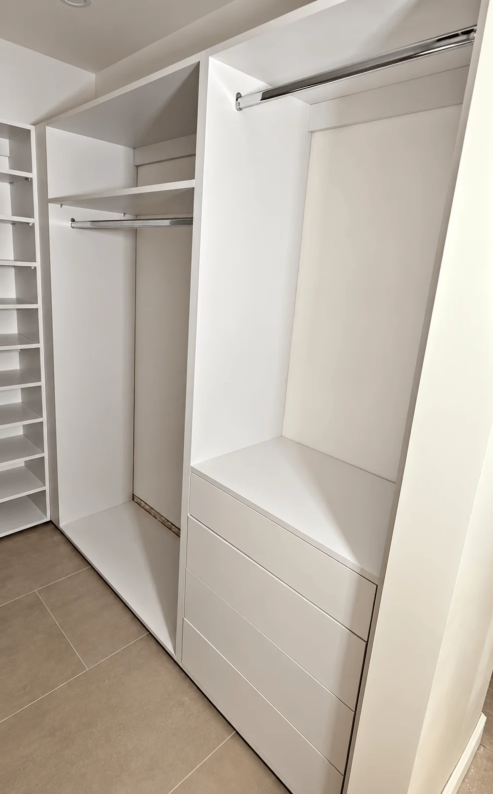 White custom closet with hanging areas and drawers